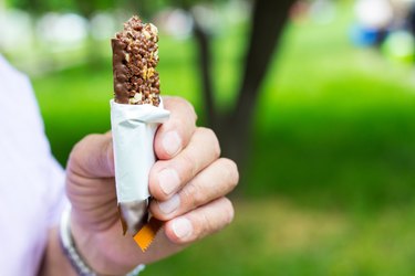 Close up of hand holding a medifast1 bar, not a medifast shake