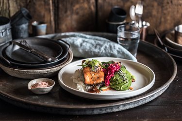 Salmon and avocado on a serving tray to show what menopause belly is, why women’s waists were so small in the 50s and how to get rid of a fupa